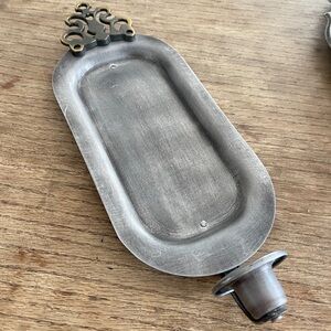 Primitive looking pewter and brass candle sconce